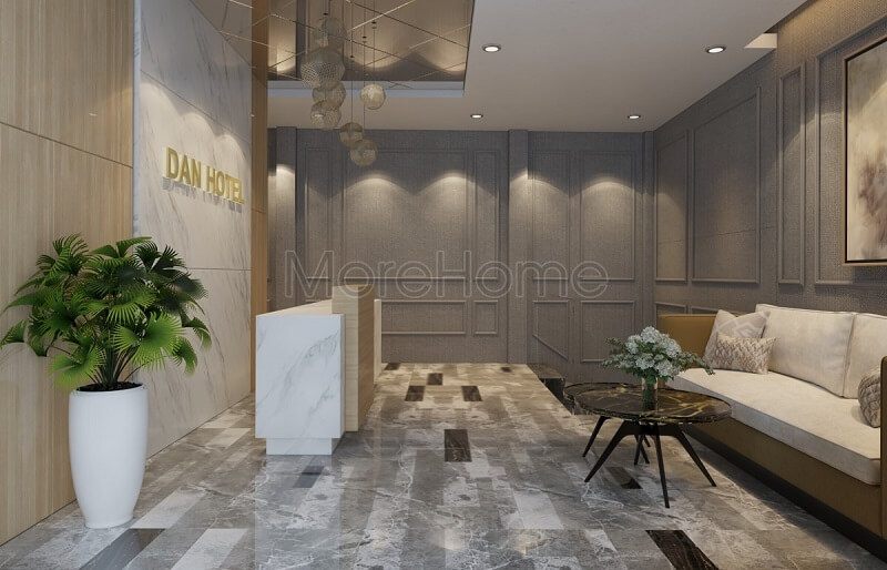 Mẫu thiết kế sảnh khách sạn đẹp với bức tường đá màu trắng tinh tế kết hợp bộ sofa vải cao cấp tạo nên không gian tinh tế, cuốn hút.